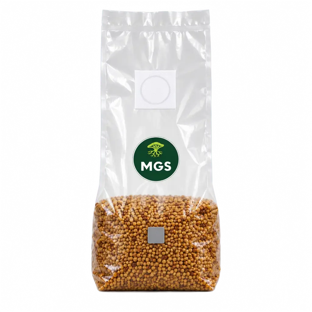 A clear bag stood upright filled with mushroom millet and milo grains, featuring a circular green Mushroom Growing Supplies branded logo label on the front along with a self healing injection port and filter patch, photographed on a clear background.